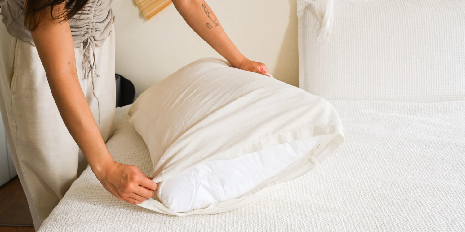 Pillow protector on a clean bed
